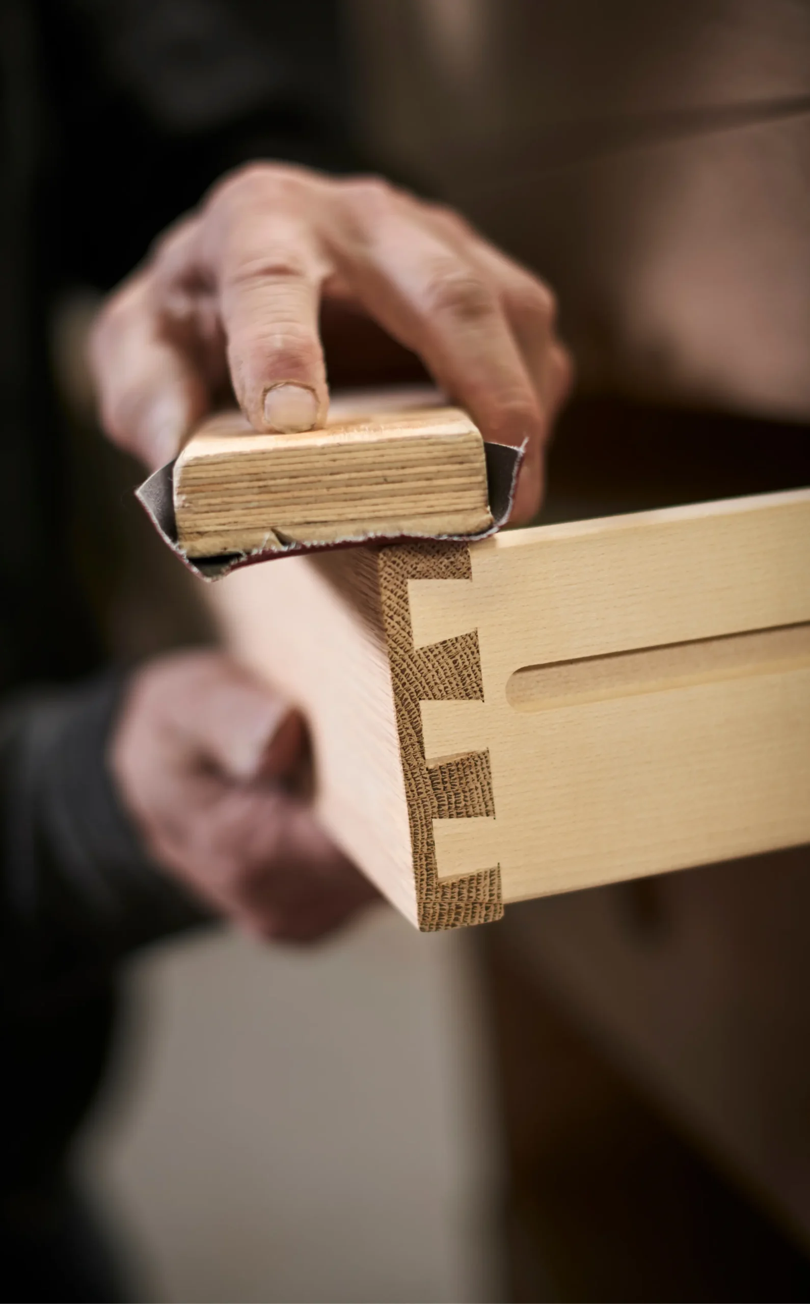 Premium wooden furniture craftsmanship and finishing work using high-quality wood materials by The RK Infra.